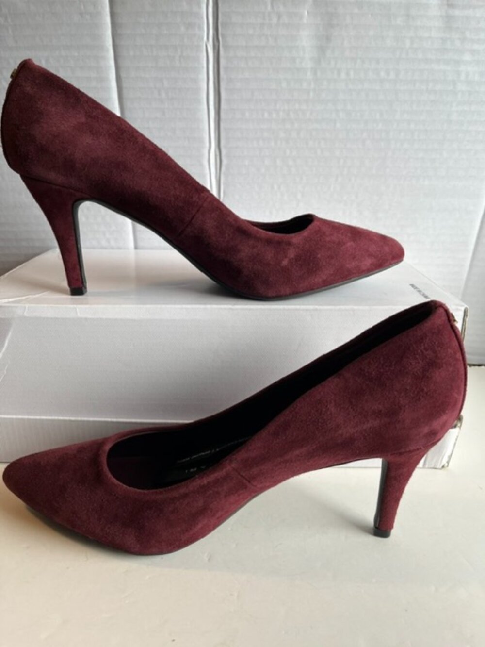 Tahari suede heeled pointed-toe pumps.